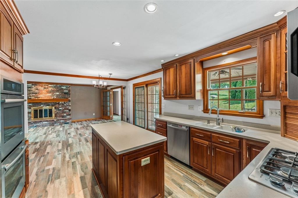 120 Timothy Road Gibsonia, PA 15044 - Photo 13 of 50 a kitchen with a stove a sink and a refrigerator