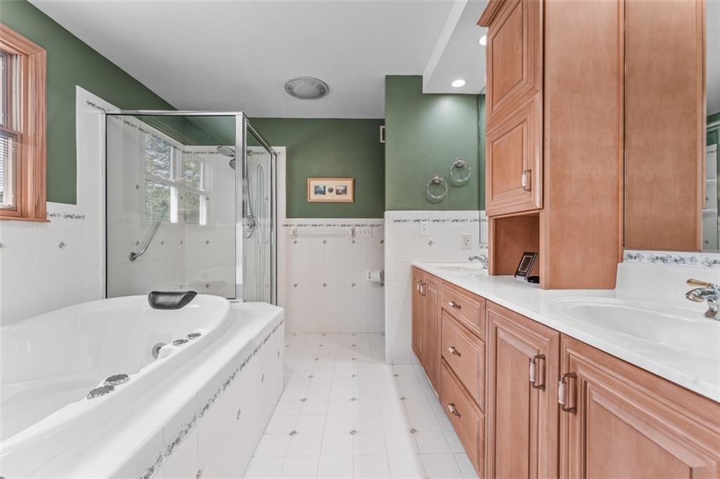 120 Timothy Road Gibsonia, PA 15044 - Photo 28 of 50 a spacious bathroom with a tub sink and mirror