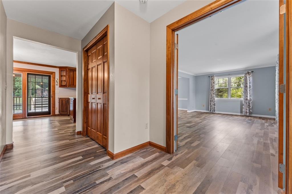 120 Timothy Road Gibsonia, PA 15044 - Photo 3 of 50 a view of a hallway with wooden floor and a living room