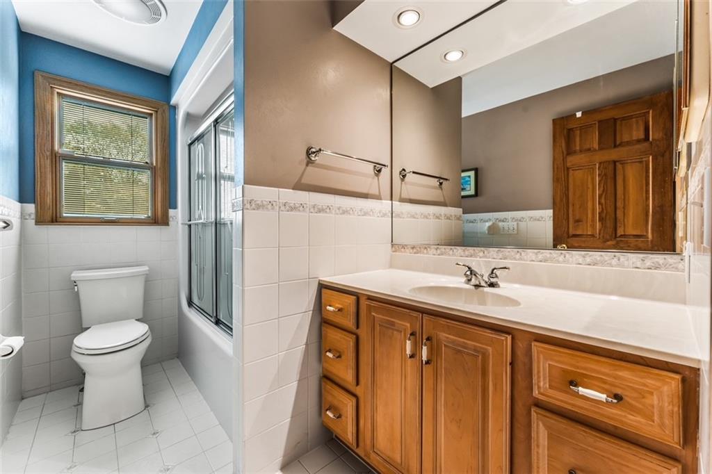 120 Timothy Road Gibsonia, PA 15044 - Photo 31 of 50 a bathroom with a granite countertop sink toilet and mirror