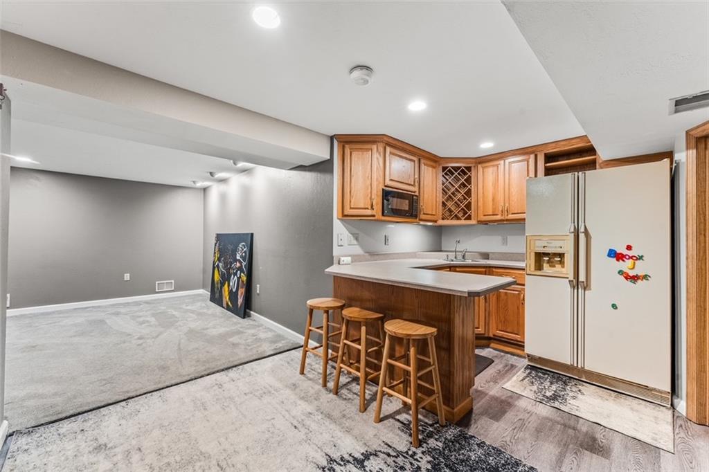120 Timothy Road Gibsonia, PA 15044 - Photo 34 of 50 a kitchen with stainless steel appliances granite countertop a stove a refrigerator and a sink