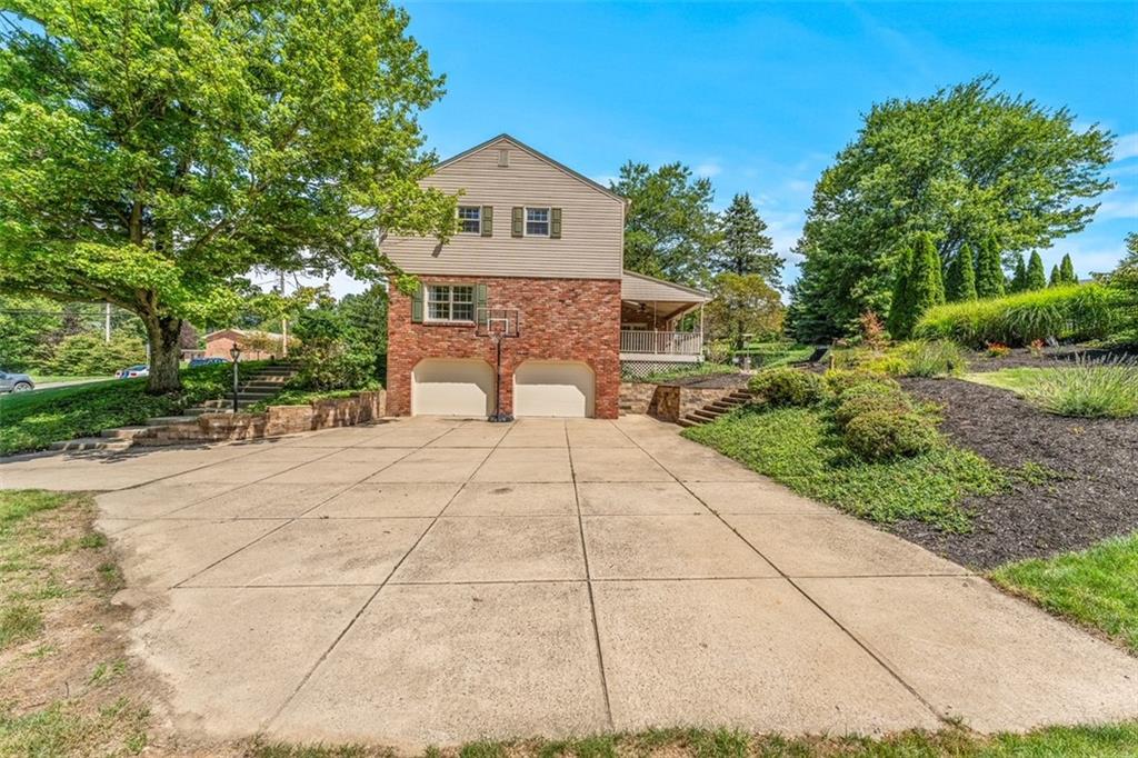 120 Timothy Road Gibsonia, PA 15044 - Photo 39 of 50 a view of a brick house with a yard