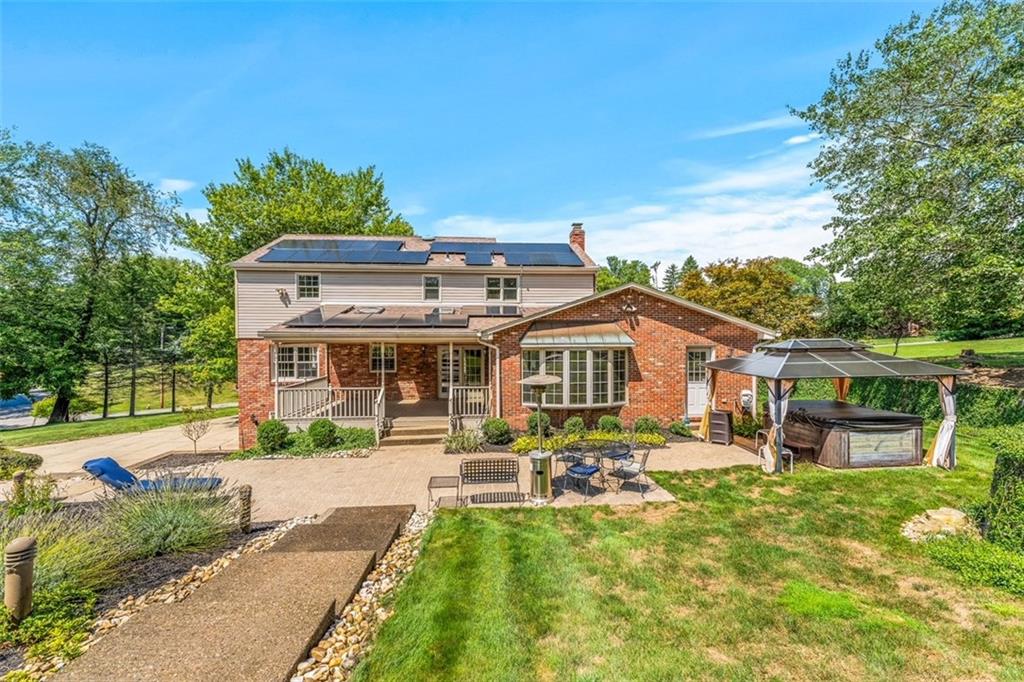 120 Timothy Road Gibsonia, PA 15044 - Photo 40 of 50 a front view of a house with a yard table and chairs