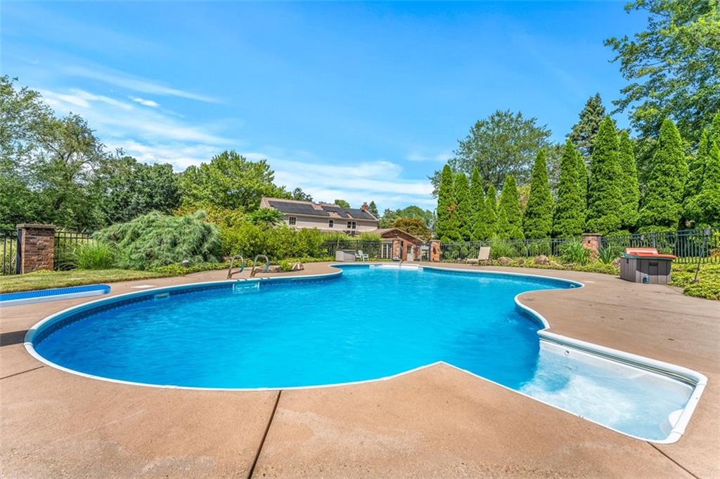 120 Timothy Road Gibsonia, PA 15044 - Photo 46 of 50 a view of a swimming pool with an outdoor seating and a garden