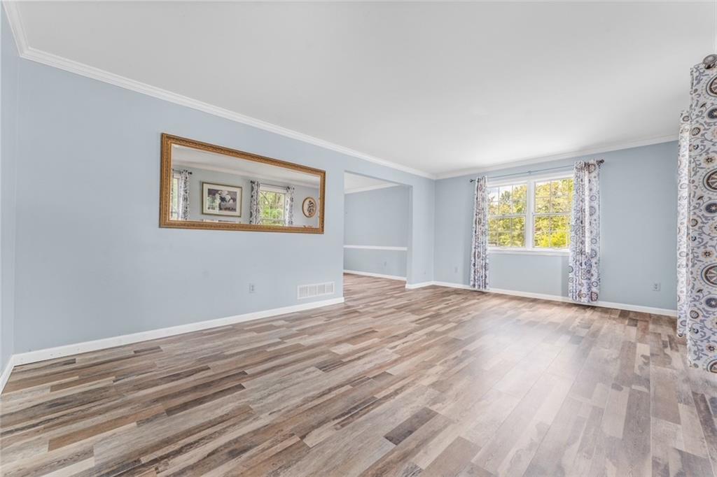 120 Timothy Road Gibsonia, PA 15044 - Photo 6 of 50 a view of an empty room with window and wooden floor