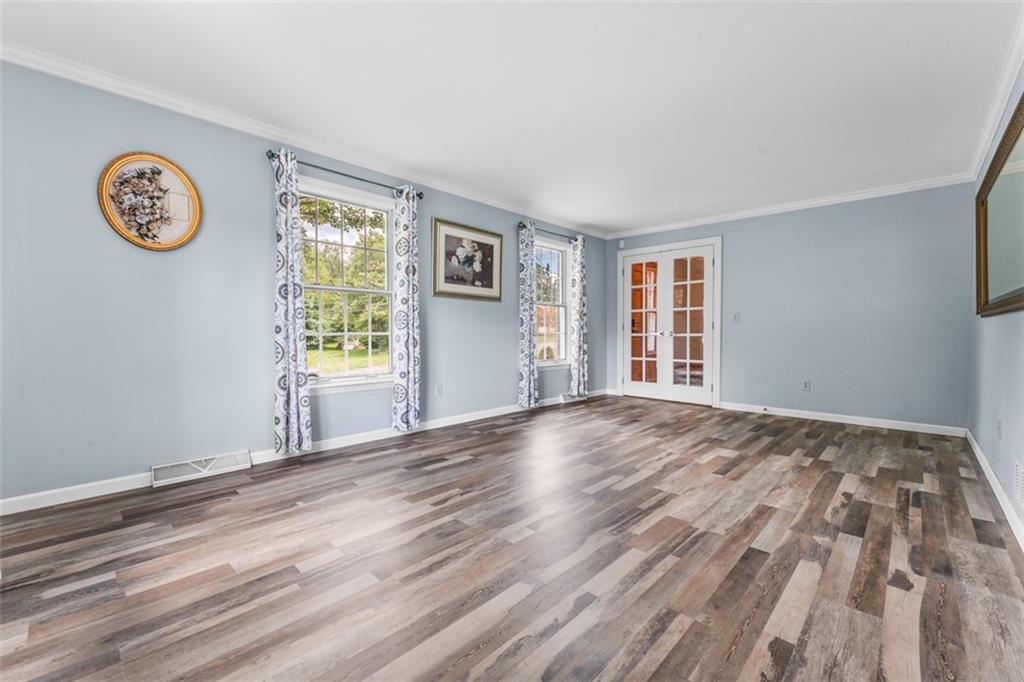120 Timothy Road Gibsonia, PA 15044 - Photo 7 of 50 a view of empty room with window and wooden floor