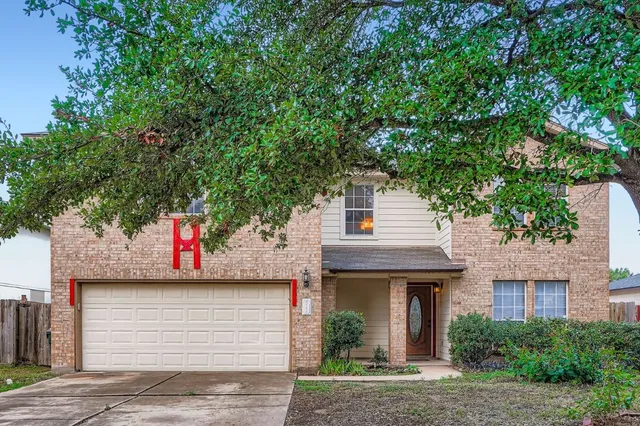 a front view of a house with garage