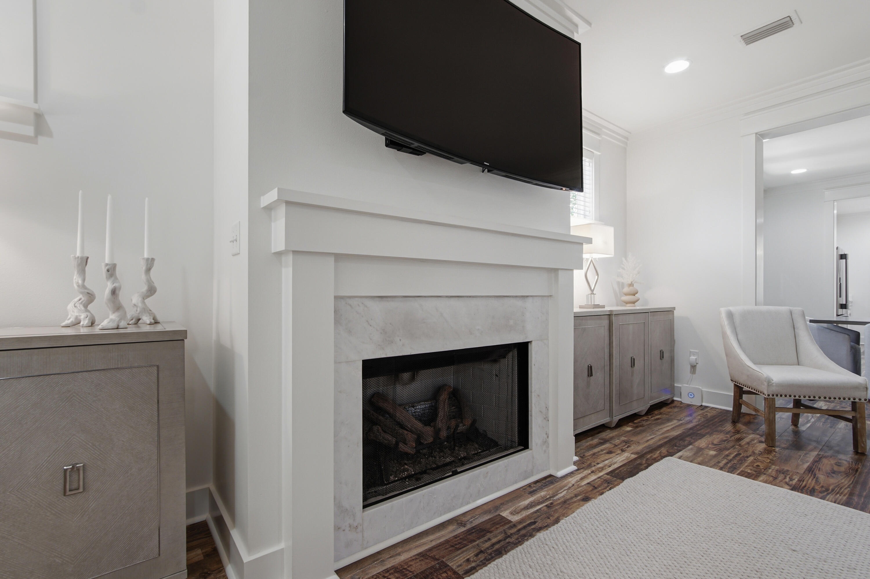 755 Breakers Street, Unit LOT 50 Inlet Beach, FL 32461 - Photo 15 of 61 a living room with furniture a fireplace and a flat screen tv