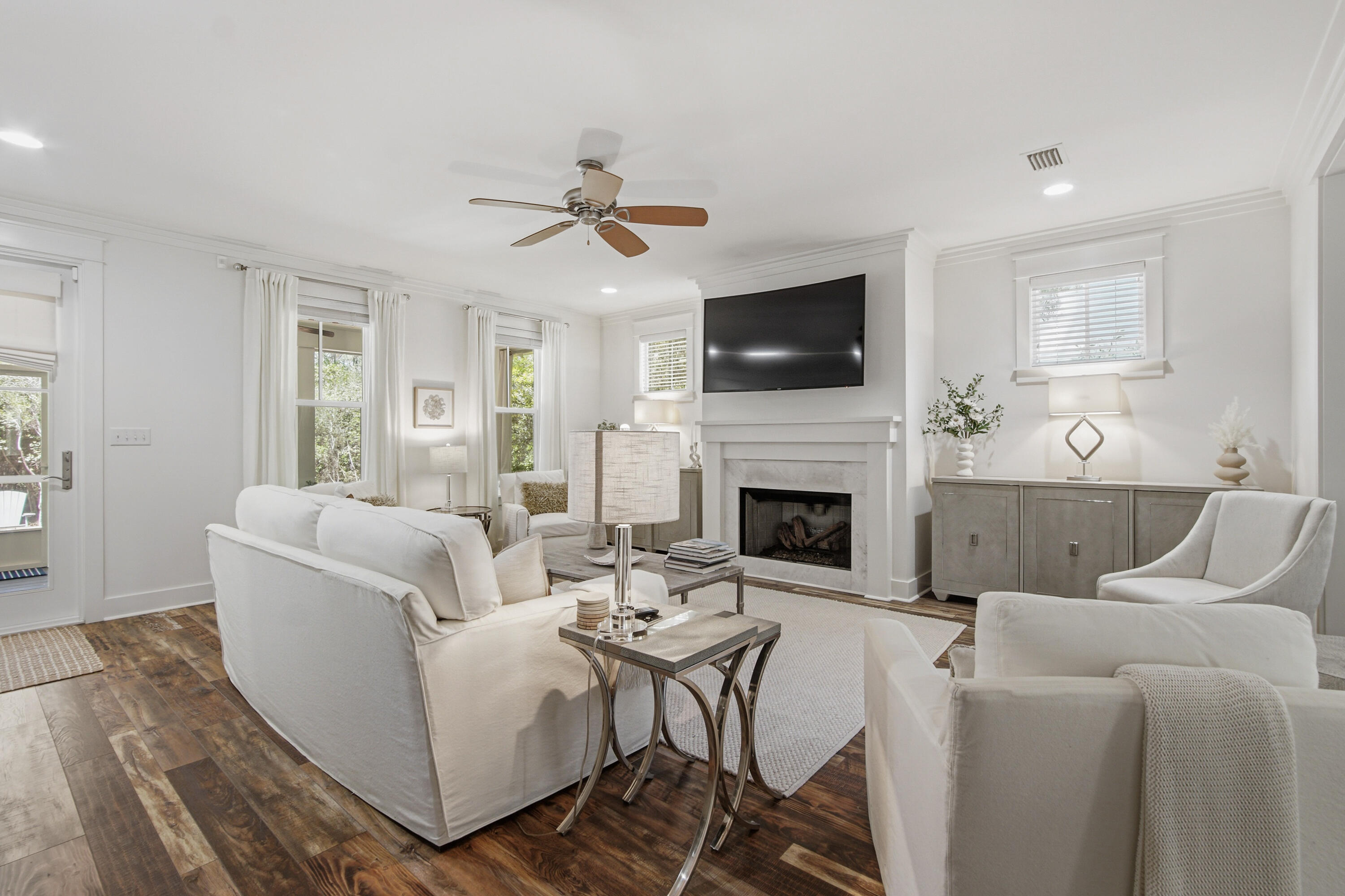 755 Breakers Street, Unit LOT 50 Inlet Beach, FL 32461 - Photo 17 of 61 a living room with furniture a fireplace and a flat screen tv