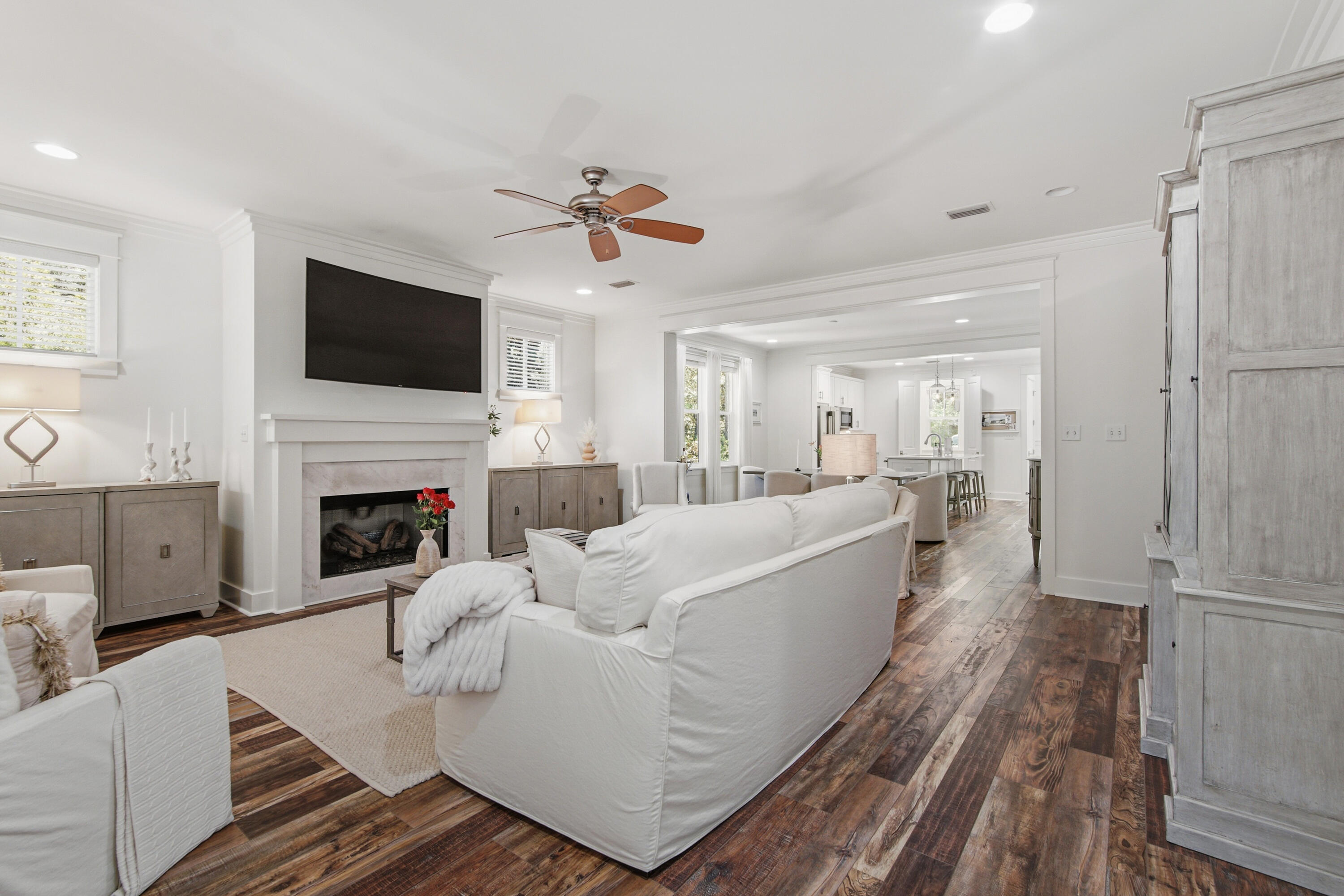 755 Breakers Street, Unit LOT 50 Inlet Beach, FL 32461 - Photo 19 of 61 a living room with furniture a flat screen tv and a fireplace
