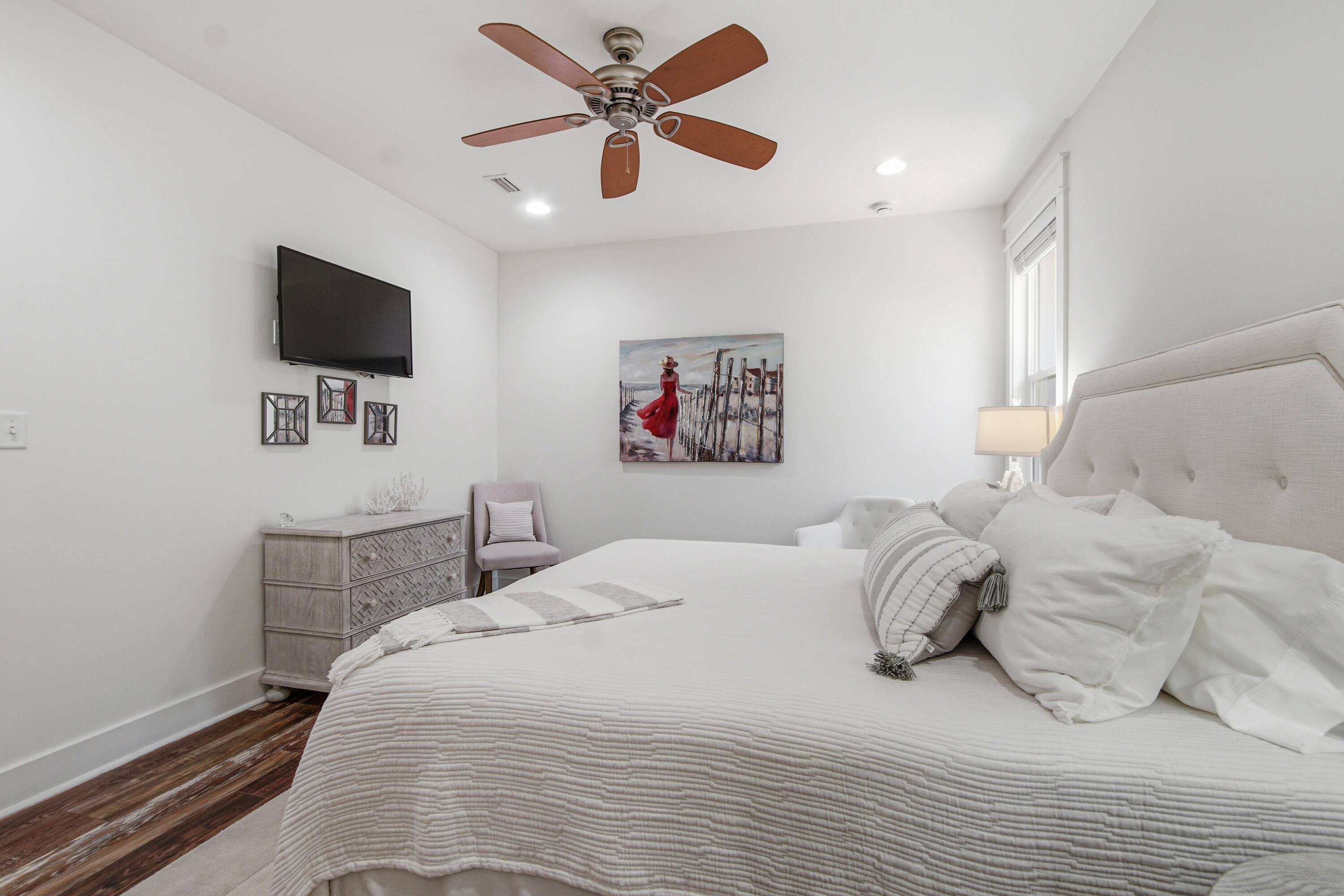 755 Breakers Street, Unit LOT 50 Inlet Beach, FL 32461 - Photo 33 of 61 a bedroom with a large bed and a flat screen tv