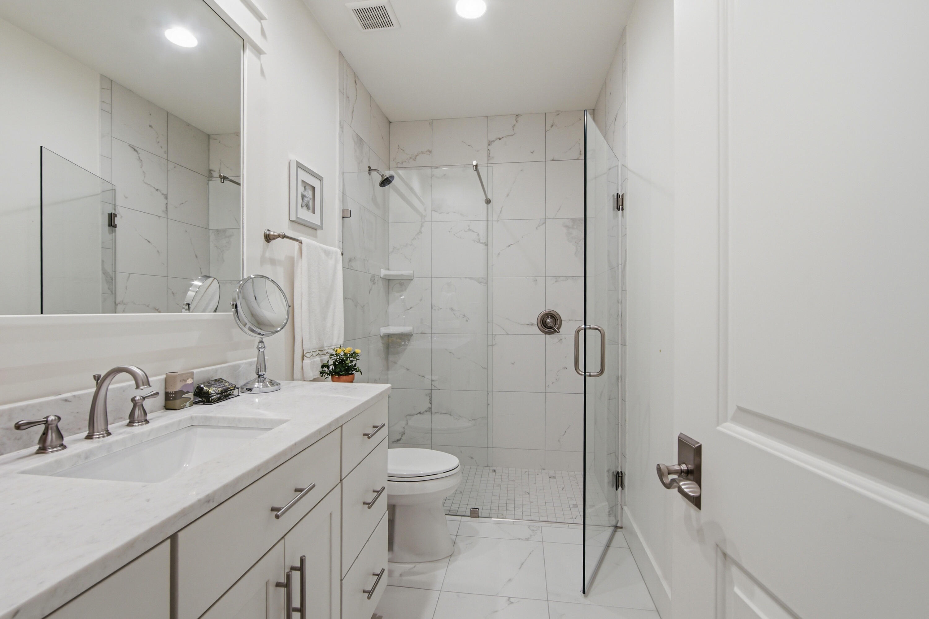 755 Breakers Street, Unit LOT 50 Inlet Beach, FL 32461 - Photo 34 of 61 a bathroom with a double vanity sink toilet and shower