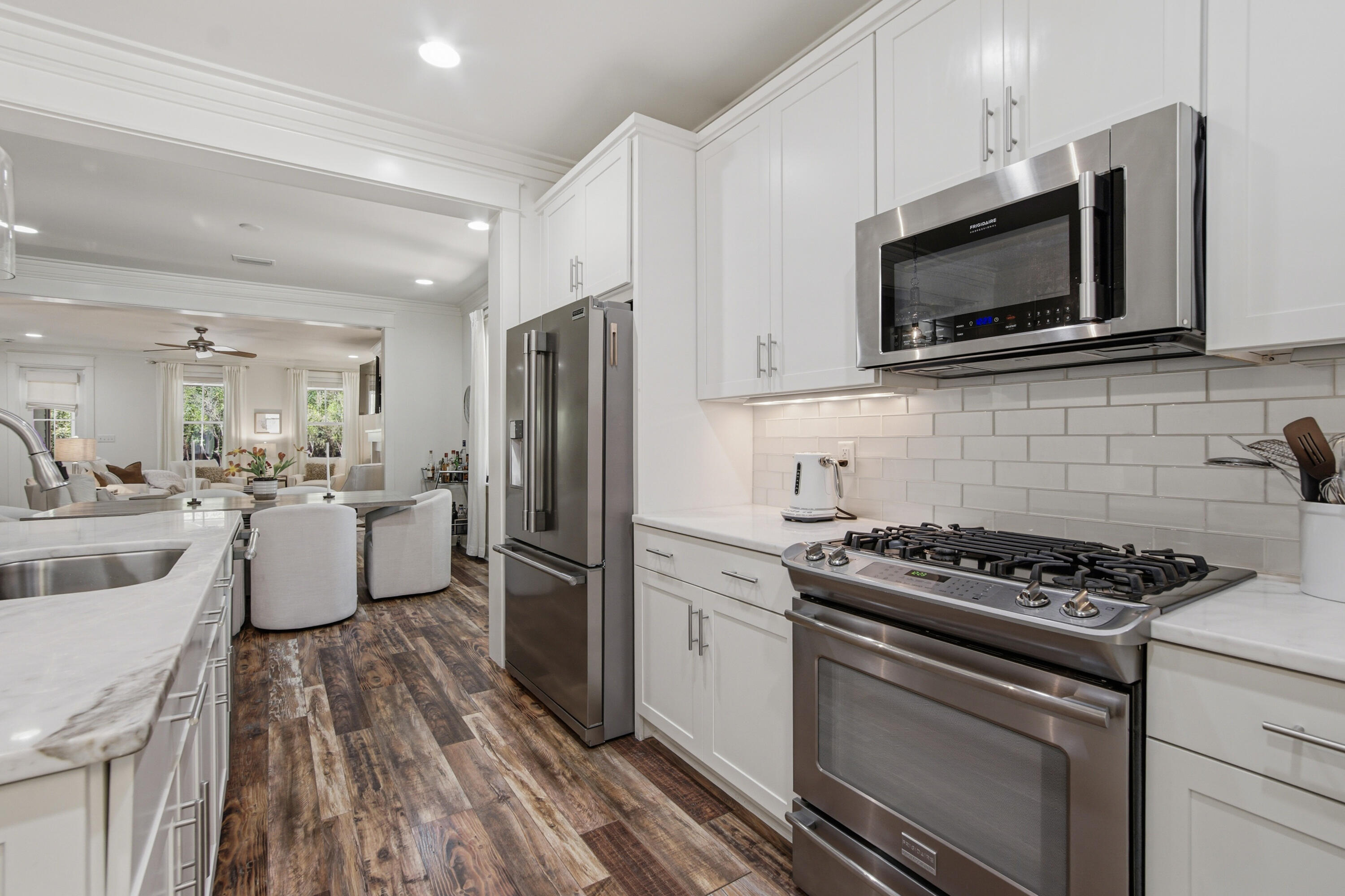 755 Breakers Street, Unit LOT 50 Inlet Beach, FL 32461 - Photo 4 of 61 a kitchen with stainless steel appliances a stove microwave and a refrigerator