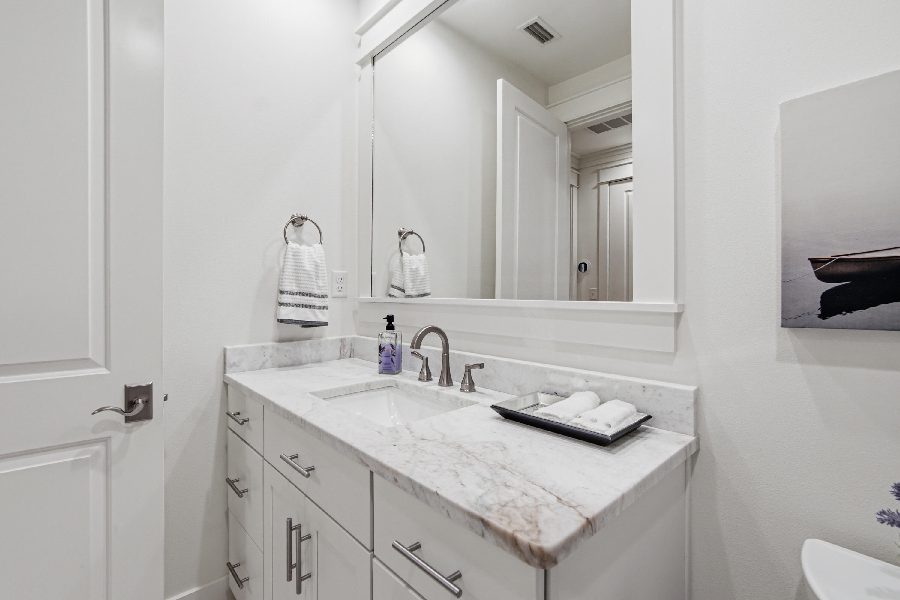 755 Breakers Street, Unit LOT 50 Inlet Beach, FL 32461 - Photo 41 of 61 a bathroom with a sink and a mirror