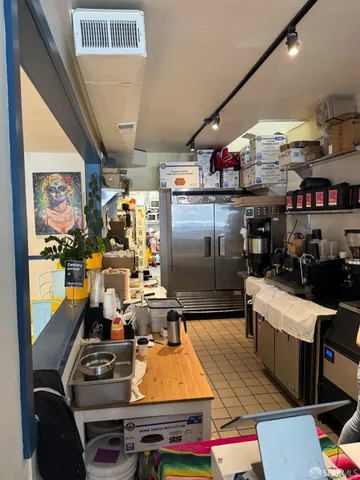 a room with lots of furniture and clutter