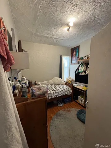 a bedroom with a bed and a walk in closet