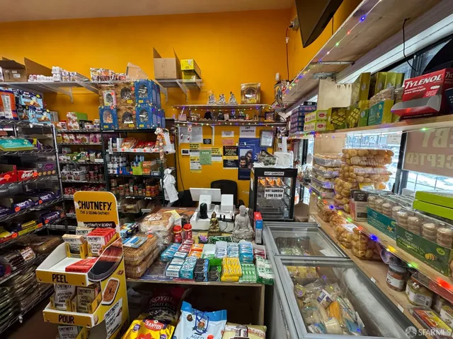a dining room with wooden floor and furniture