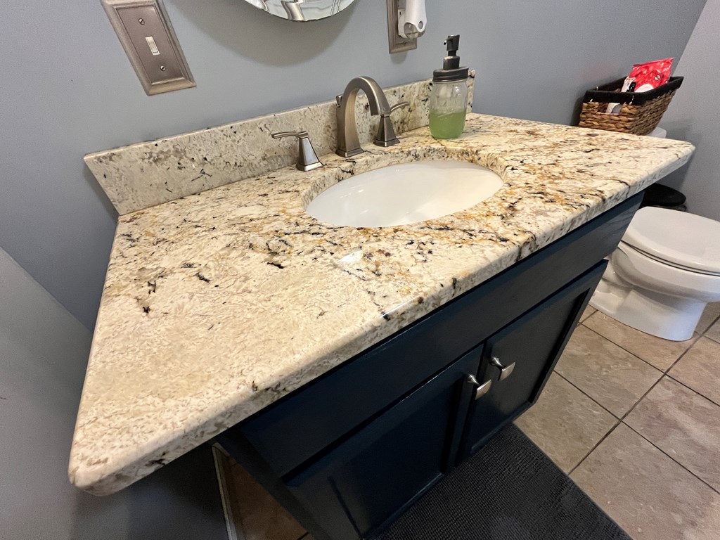 2761 Bush Road Spring Creek, PA 16436 - Photo 17 of 86 a bath room with a granite countertop sink and a mirror