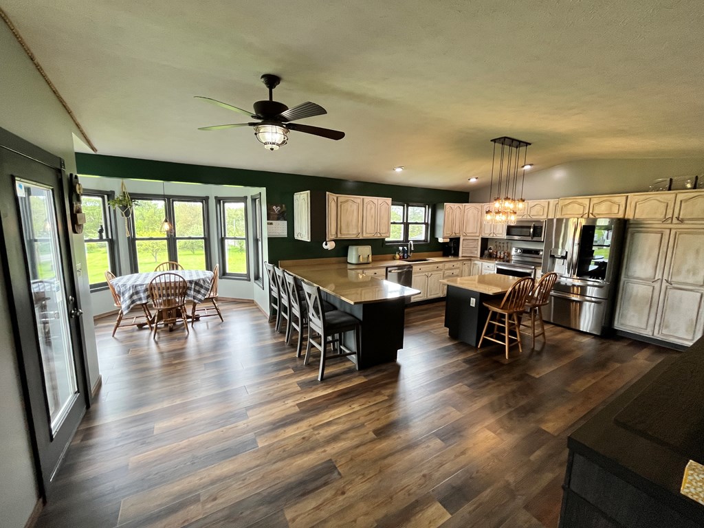 2761 Bush Road Spring Creek, PA 16436 - Photo 20 of 86 a living room with lots of furniture and kitchen view
