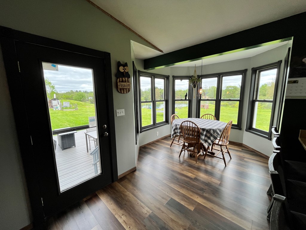 2761 Bush Road Spring Creek, PA 16436 - Photo 22 of 86 a view of a dining room with furniture window and wooden floor