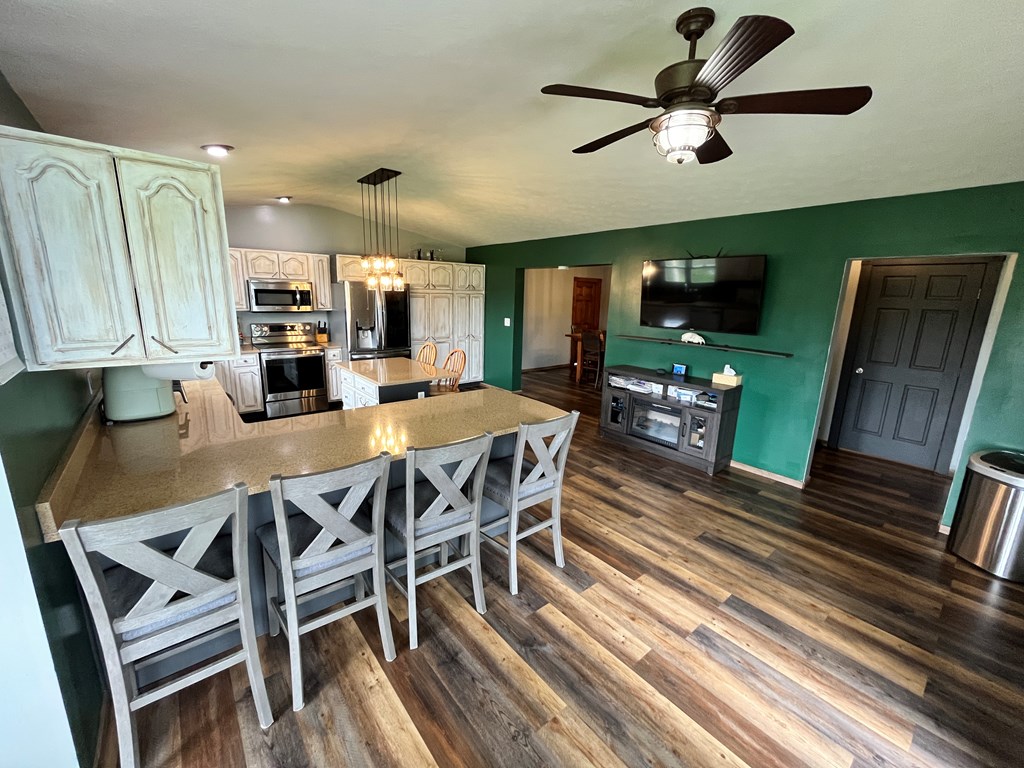 2761 Bush Road Spring Creek, PA 16436 - Photo 24 of 86 a view of a dining room with furniture window and wooden floor