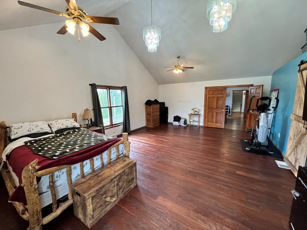 2761 Bush Road Spring Creek, PA 16436 - Photo 71 of 86 a bedroom with bed and wooden floor