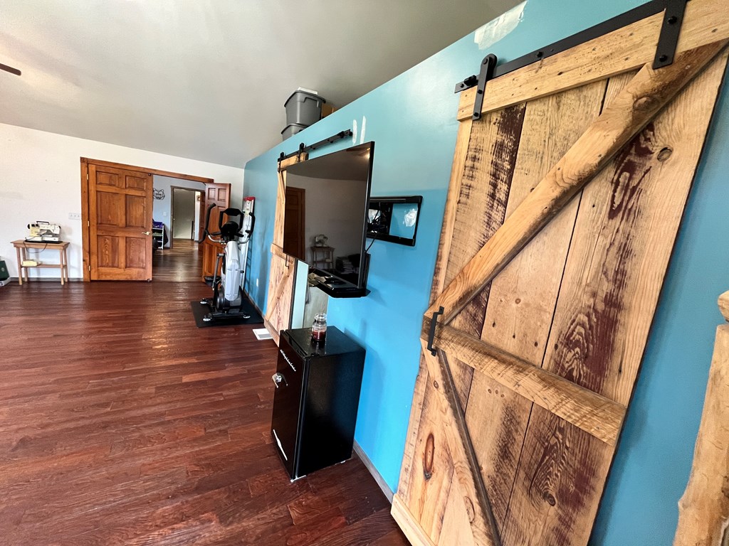 2761 Bush Road Spring Creek, PA 16436 - Photo 72 of 86 a view of a livingroom with wooden floor and furniture