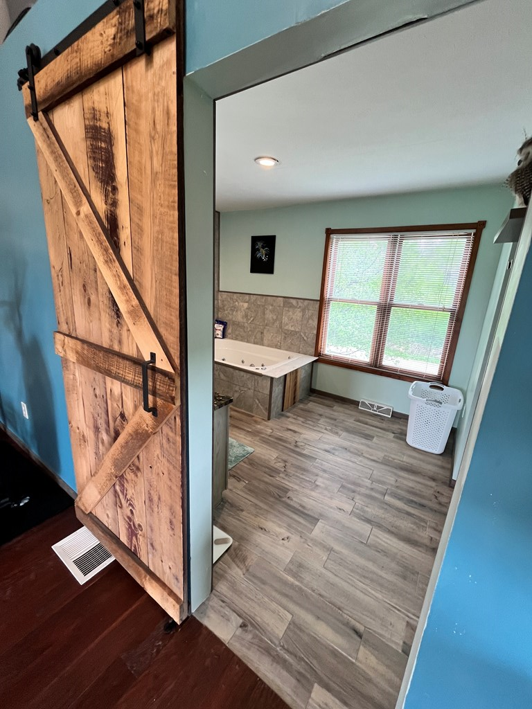 2761 Bush Road Spring Creek, PA 16436 - Photo 75 of 86 a view of entryway and hall with wooden floor