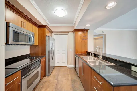 a kitchen with stainless steel appliances granite countertop a stove and a sink