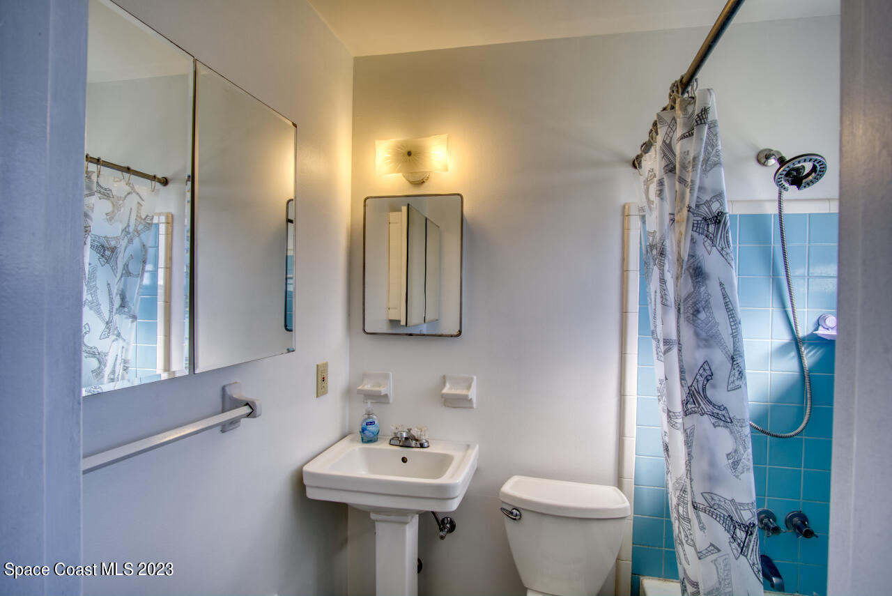 3101 Dairy Road Melbourne, FL 32901 - Photo 16 of 28 a bathroom with a sink toilet and shower