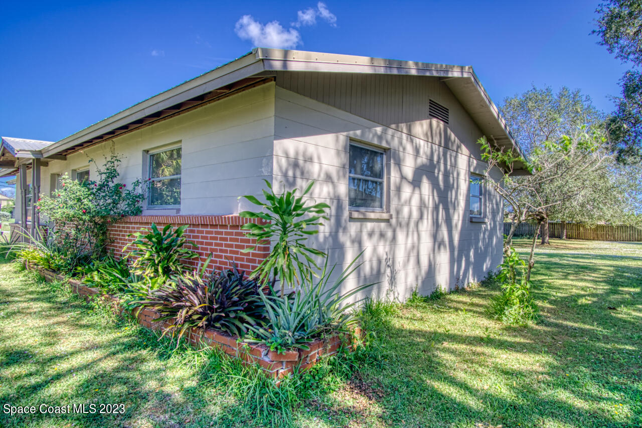 3101 Dairy Road Melbourne, FL 32901 - Photo 17 of 28 a front view of a house with a yard