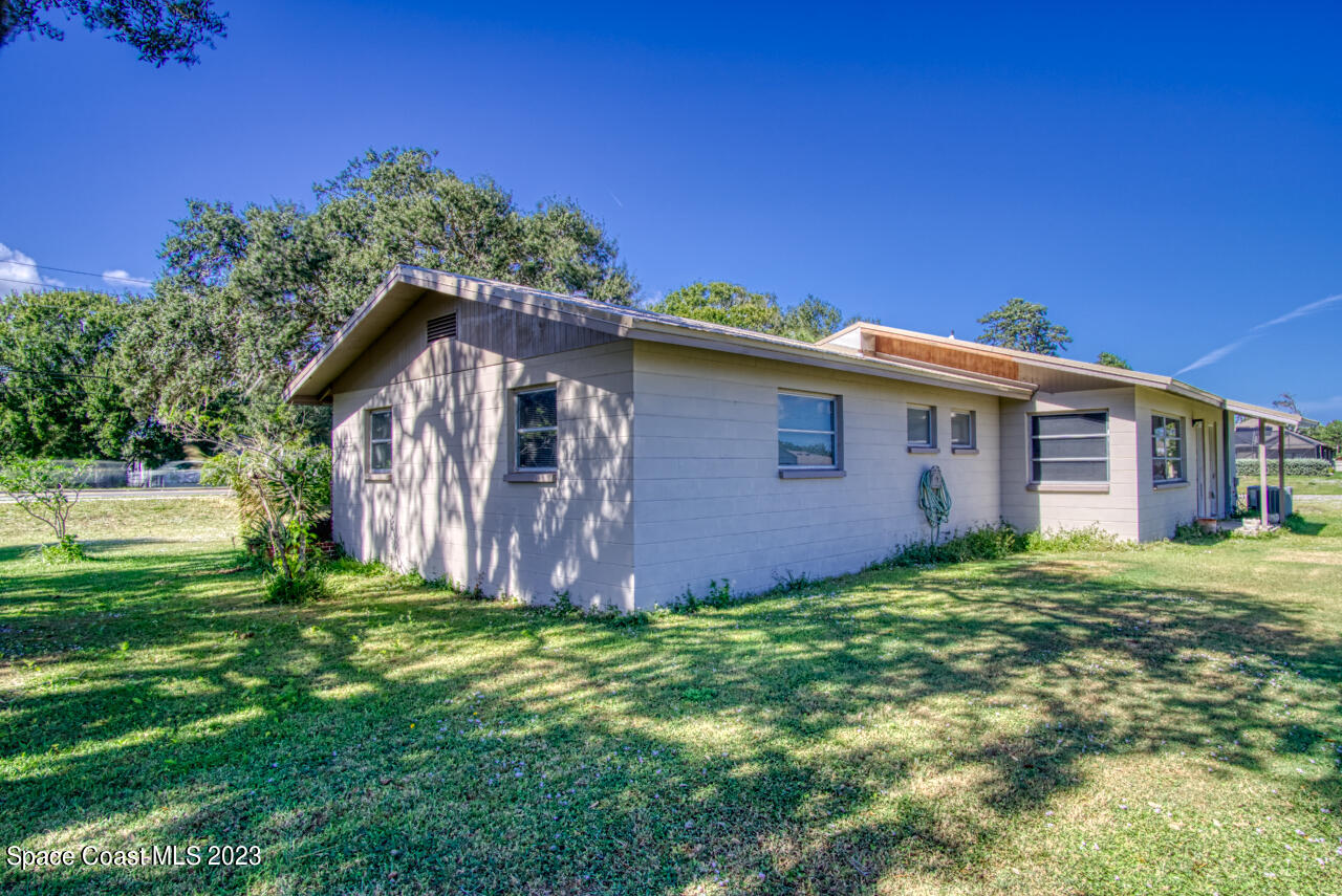 3101 Dairy Road Melbourne, FL 32901 - Photo 18 of 28 a view of a house with a yard