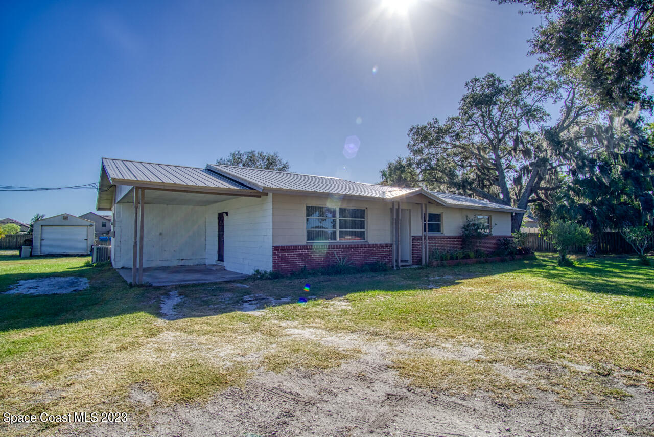 3101 Dairy Road Melbourne, FL 32901 - Photo 2 of 28 a view of a house with a yard