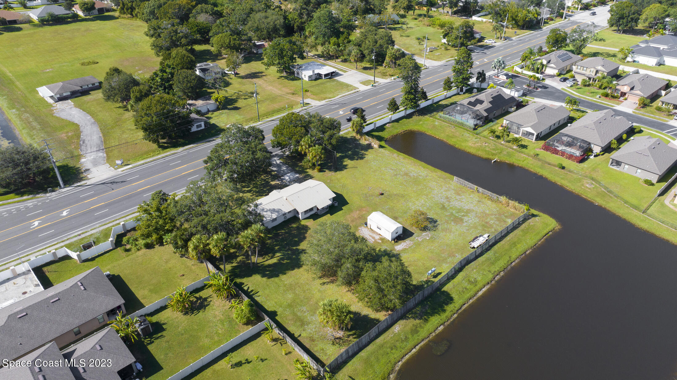 3101 Dairy Road Melbourne, FL 32901 - Photo 25 of 28 an aerial view of residential houses with outdoor space