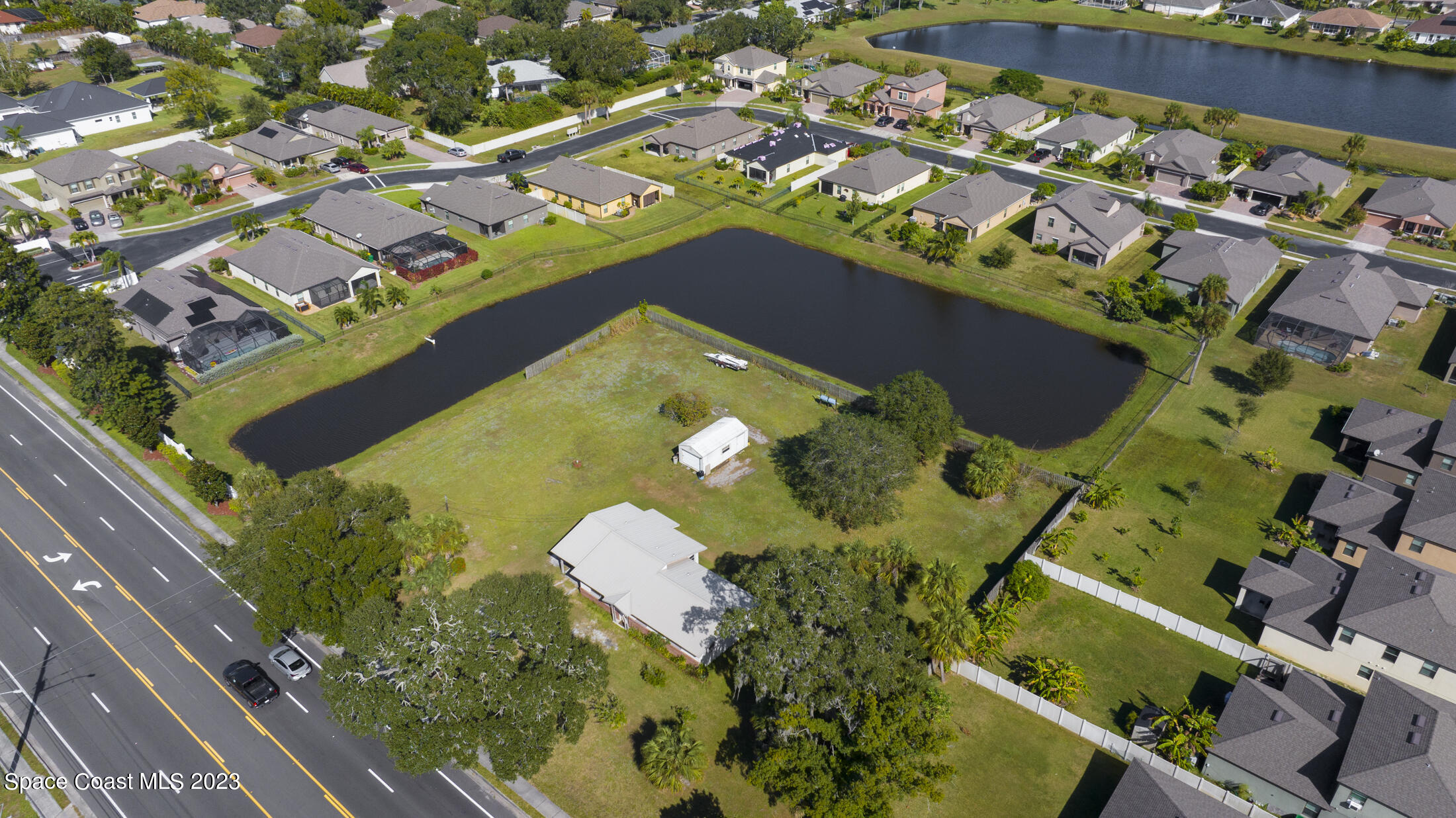 3101 Dairy Road Melbourne, FL 32901 - Photo 27 of 28 an aerial view of a residential houses with outdoor space