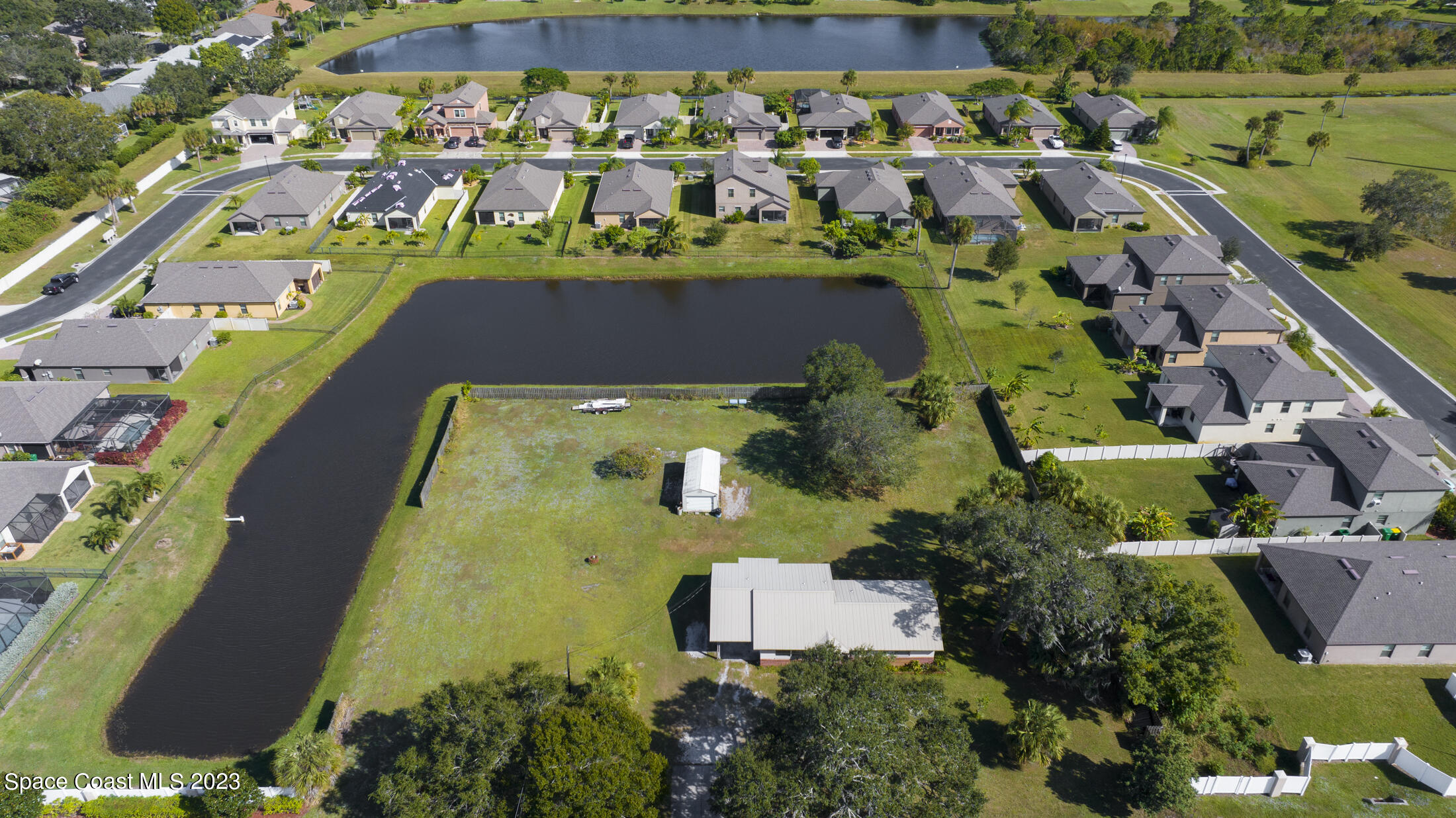 3101 Dairy Road Melbourne, FL 32901 - Photo 28 of 28 an aerial view of residential houses with outdoor space