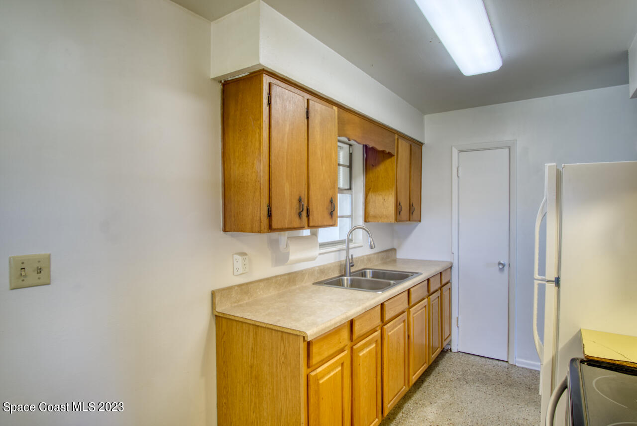 3101 Dairy Road Melbourne, FL 32901 - Photo 6 of 28 a bathroom with a sink and a mirror