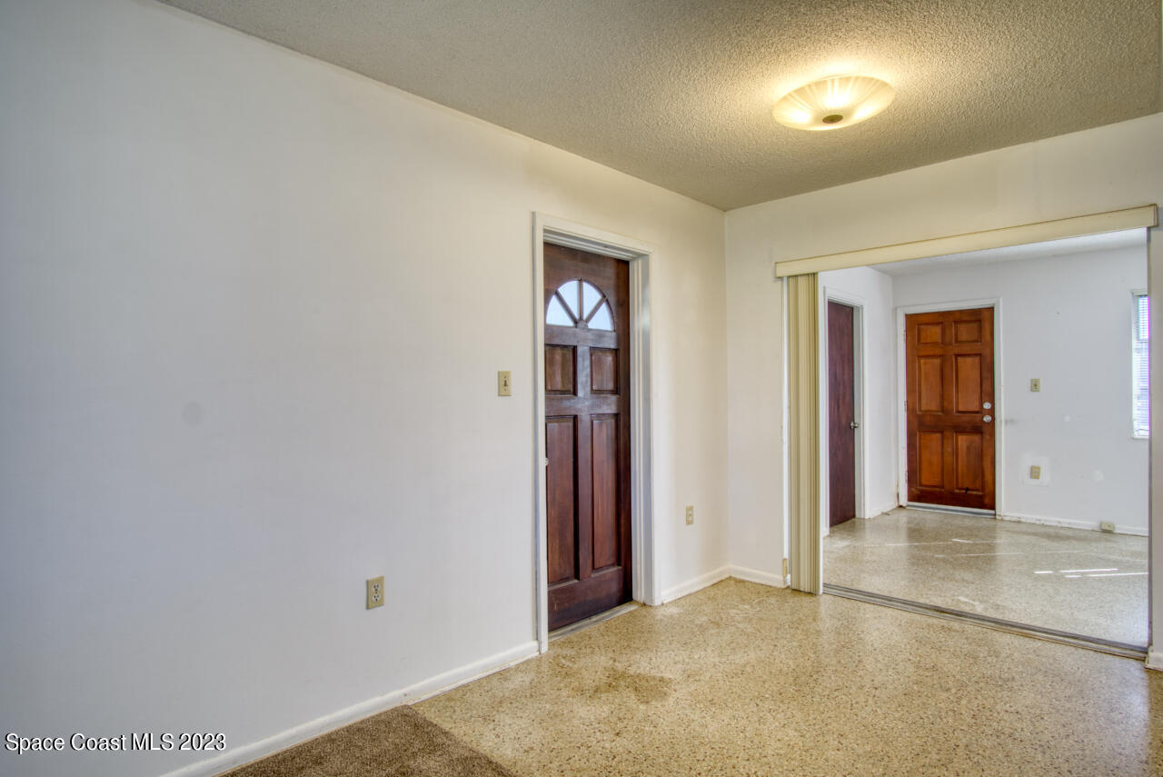 3101 Dairy Road Melbourne, FL 32901 - Photo 7 of 28 an empty room with closet and mirror