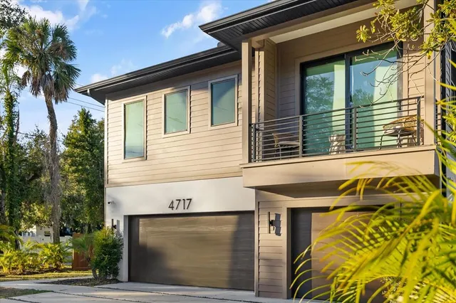 a front view of a house with a garage