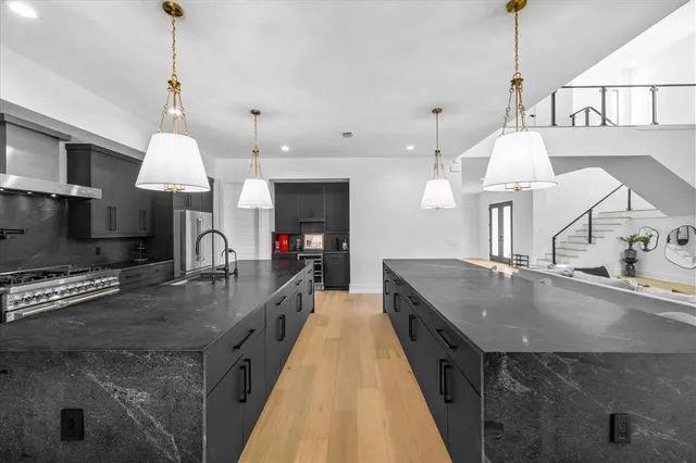 a bedroom with a large bed and a large window