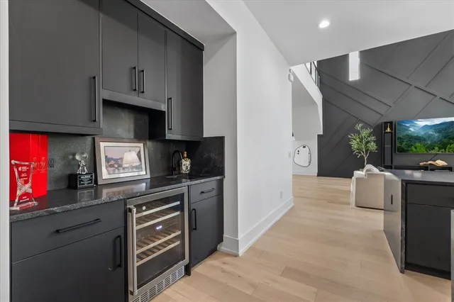 a view of a balcony with wooden floor and fence