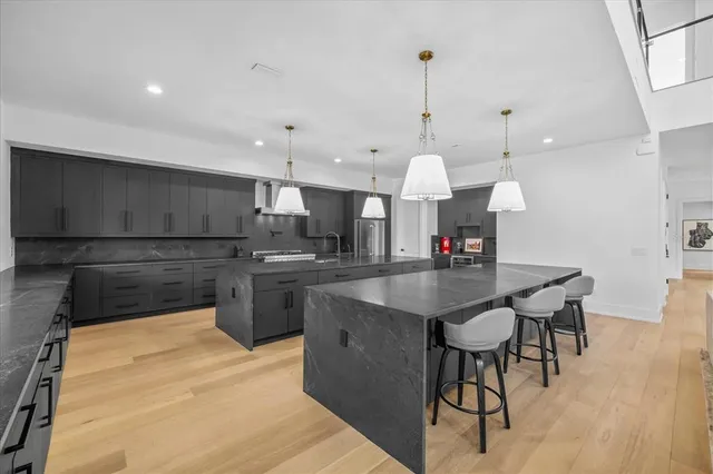 a dining room with furniture and a chandelier