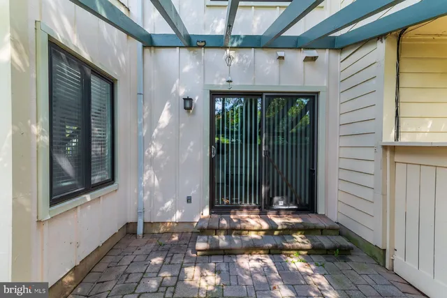 a view of a balcony with chair and tables