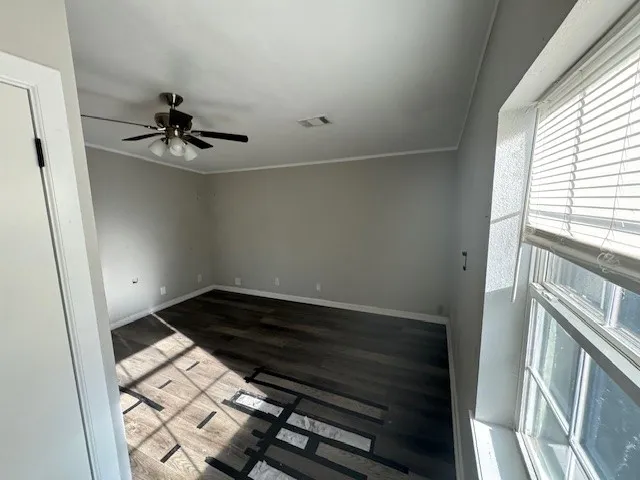 a view of an empty room with a window