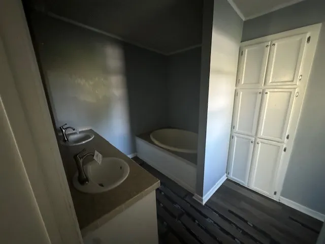 a bathroom with a sink and a washer dryer