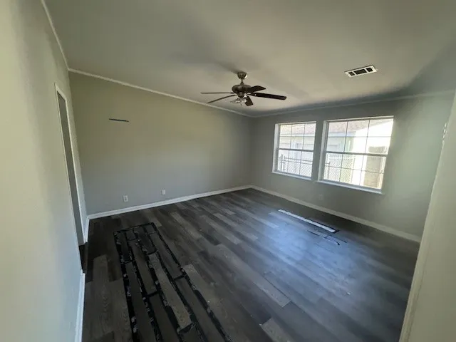 a view of an empty room with a window