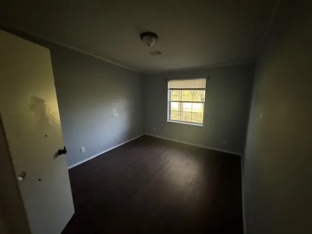 a view of an empty room and window