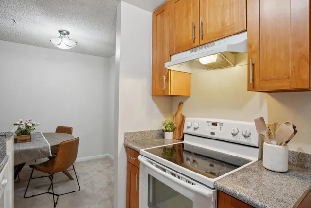 a kitchen with a sink cabinets and appliances