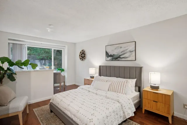 a bedroom with a bed and a window