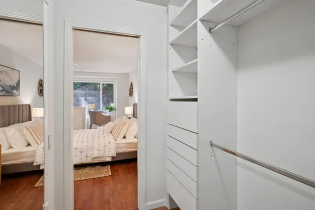 a bedroom with furniture and a window